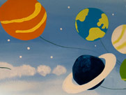 planetas dibujados en un mural infantil